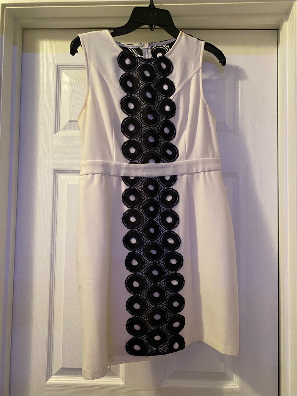 Sleeveless White Mini Dress with Black Circular Lace Panel